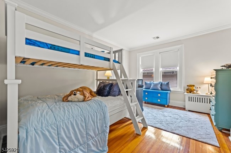 166 Valley Road Montclair, NJ 07042 - Photo 33 of 37 a bedroom with bed and a window