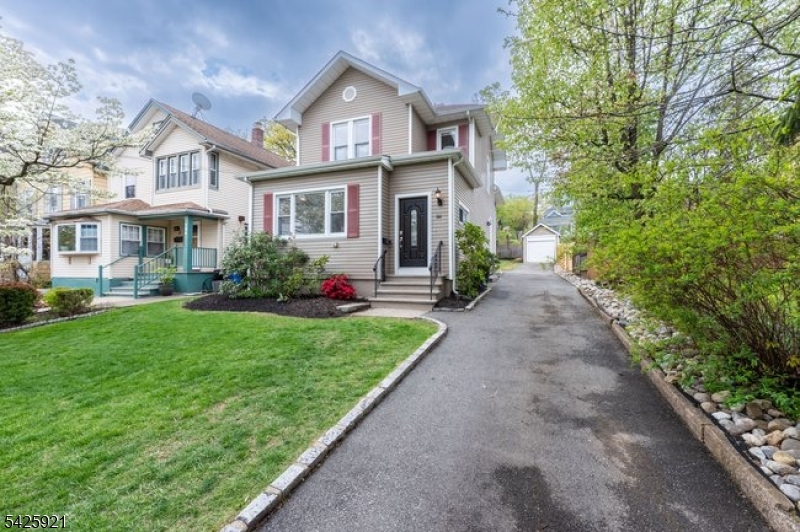 166 Valley Road Montclair, NJ 07042 - Photo 36 of 37 a front view of a house with a yard and trees