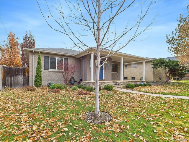 front view of a house with a chairs