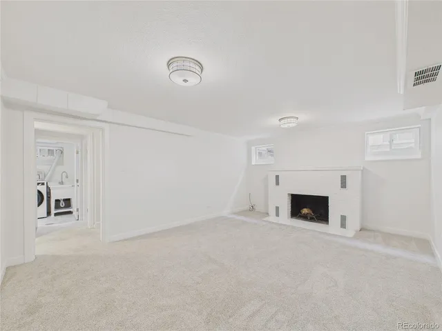 an empty room with fireplace