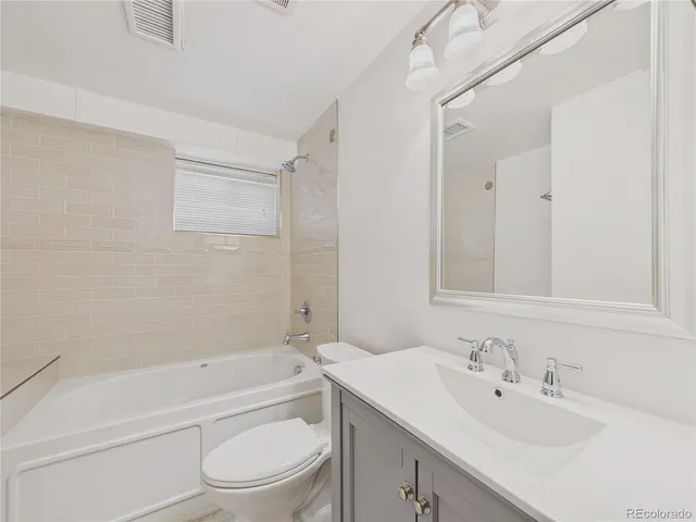 an empty room with a empty space and windows