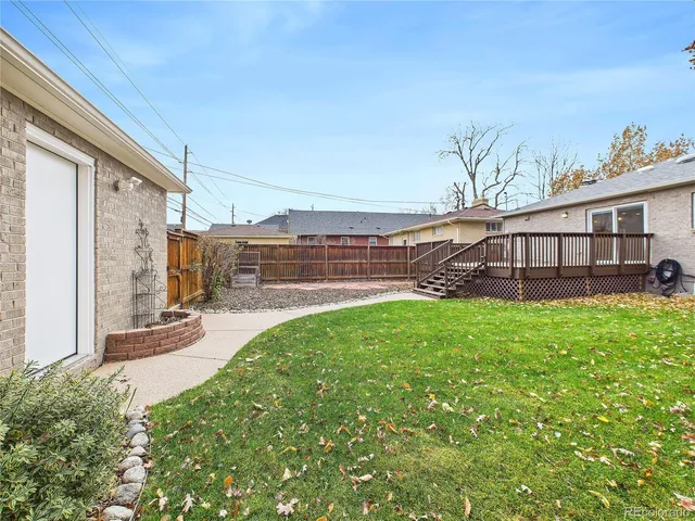 a view of a balcony with wooden floor