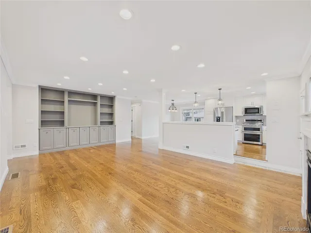a view of kitchen with refrigerator and window