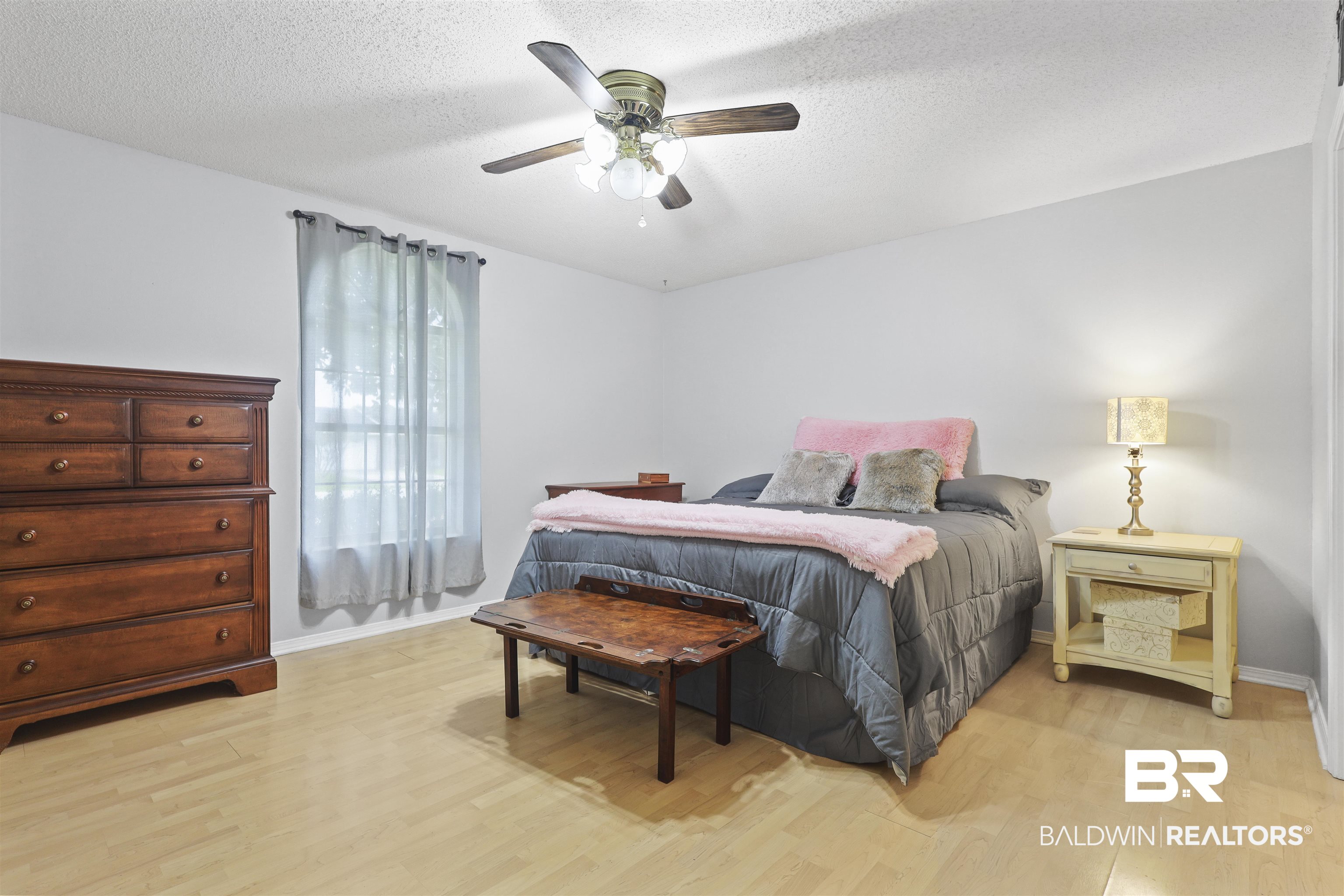507 West Amanda Avenue Foley, AL 36535 - Photo 6 of 23 Bedroom featuring ceiling fan, a textured ceiling, and light hardwood / wood-style flooring