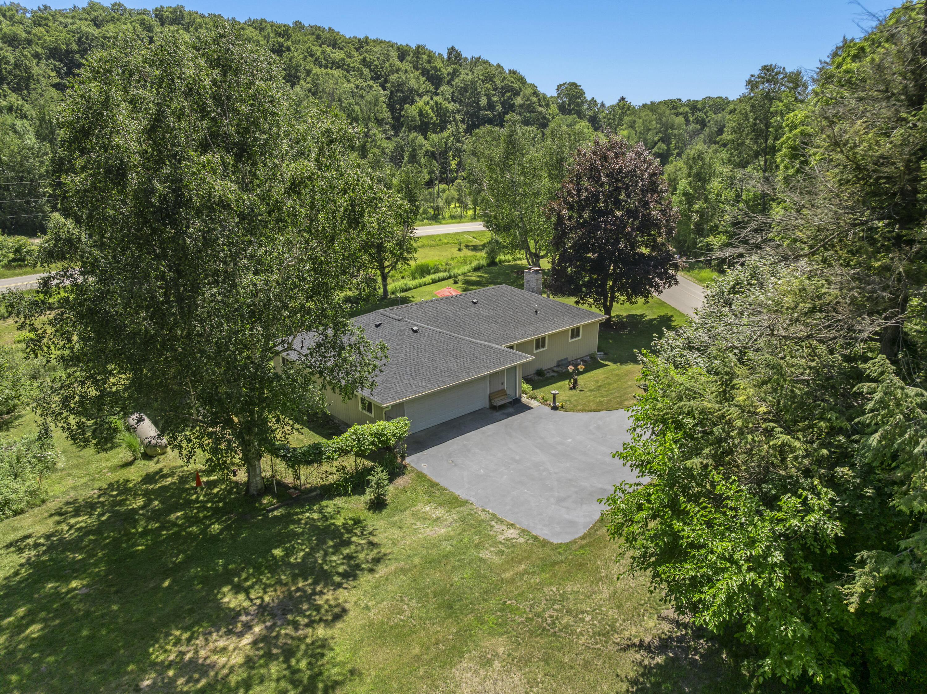 8468 Narrow Gauge Road Beulah, MI 49617 - Photo 3 of 39 DJI_20260714153557_0040_D