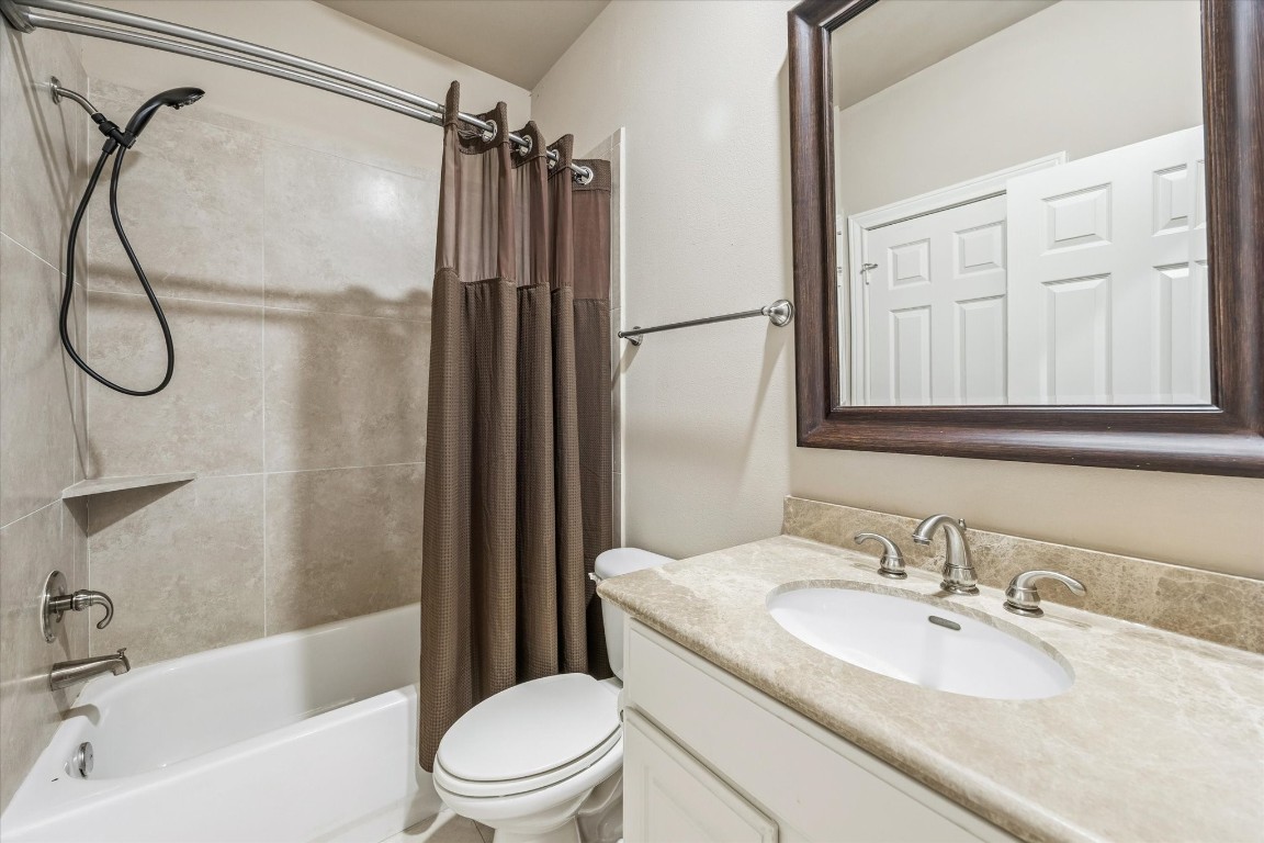 1020 Wagner Street Houston, TX 77007 - Photo 17 of 28 a bathroom with a granite countertop sink toilet and shower