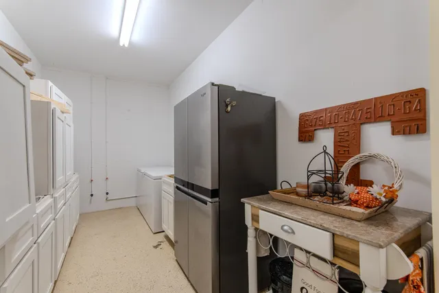 a kitchen with stainless steel appliances a refrigerator and a stove