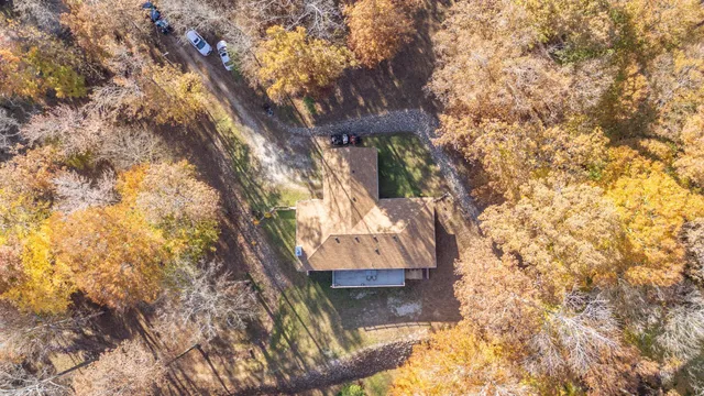 a view of a house with backyard porch and sitting area