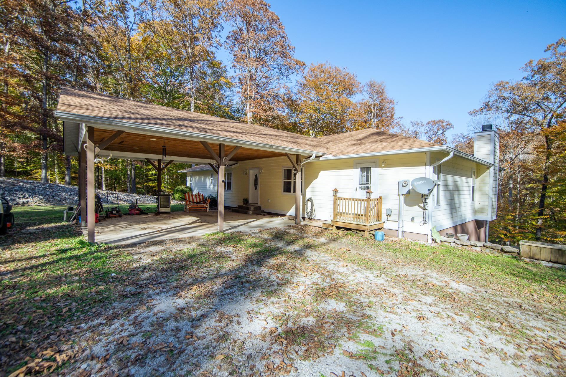 2411 Keazey Hollow Road Waynesboro, TN 38485 - Photo 31 of 38 a view of a house with backyard porch and sitting area