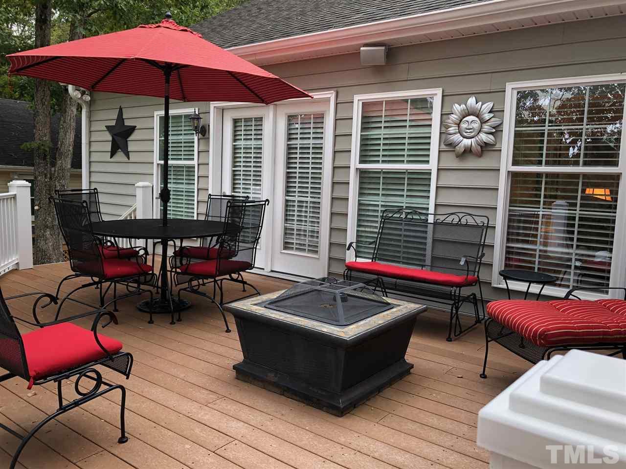 9552 George Ruff Road Bullock, NC 27507 - Photo 22 of 30 a view of a chairs and tables in the patio