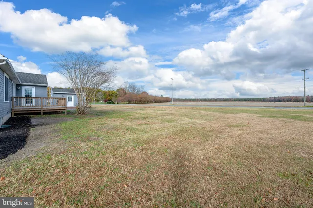 a view of a lake with houses in the background