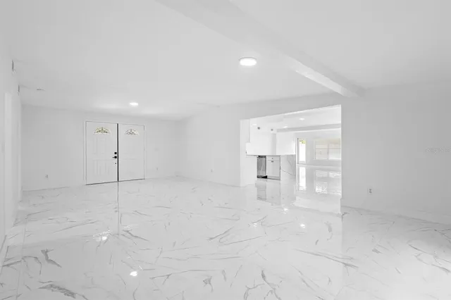 a kitchen with a sink stove and microwave