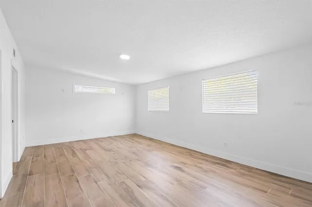 an empty room with white walls