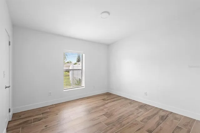 an aerial view of a house with a yard and a fountain