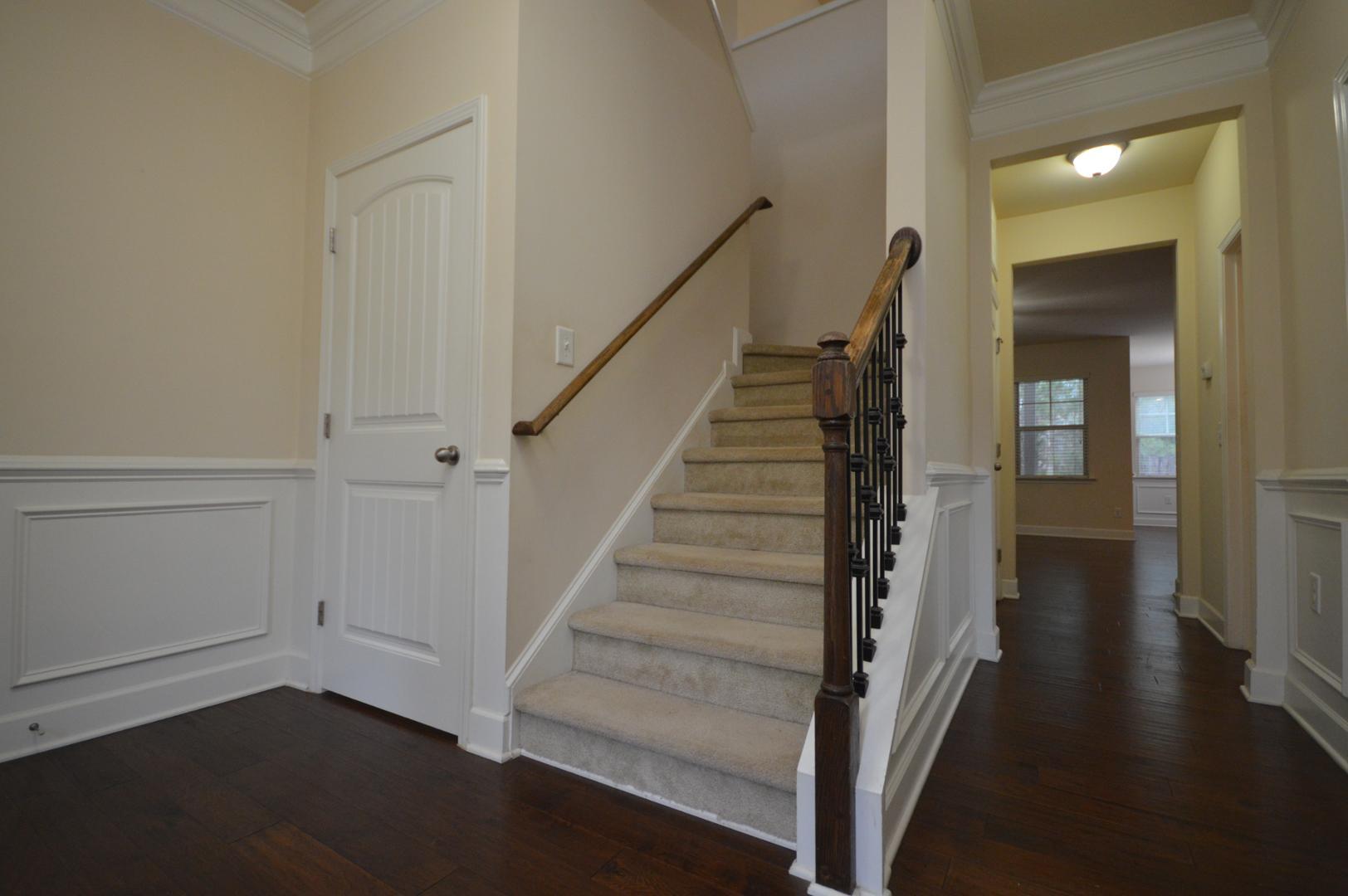 2053 Weston Green Loop Cary, NC 27513 - Photo 16 of 35 a view of a hallway with wooden floor and entryway
