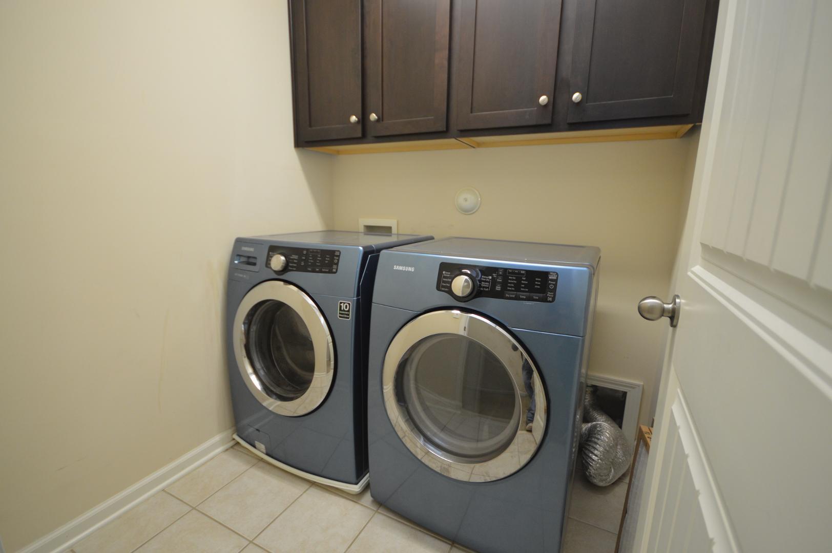 2053 Weston Green Loop Cary, NC 27513 - Photo 22 of 35 a utility room with dryer and washer