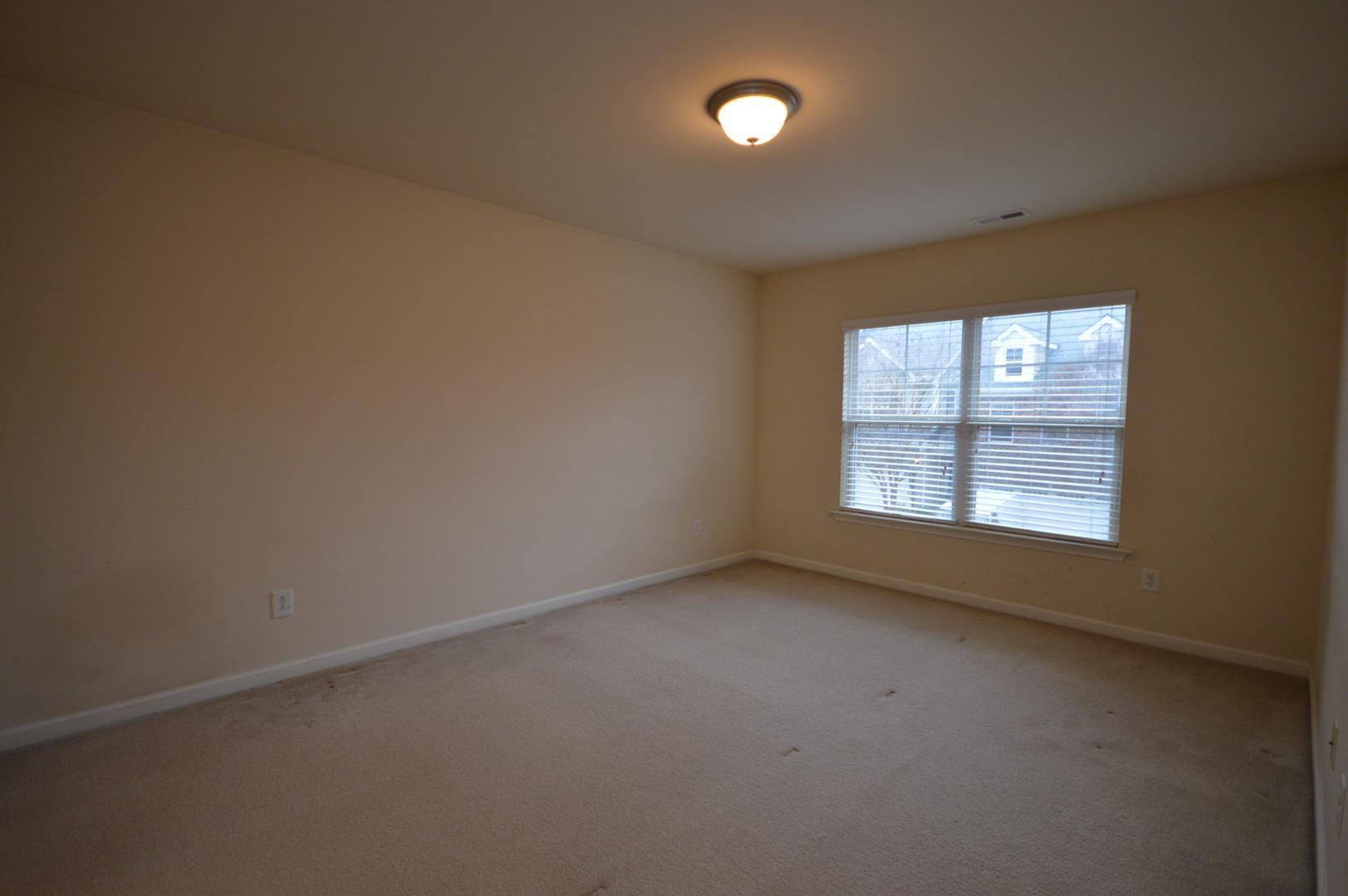 2053 Weston Green Loop Cary, NC 27513 - Photo 23 of 35 an empty room with a window