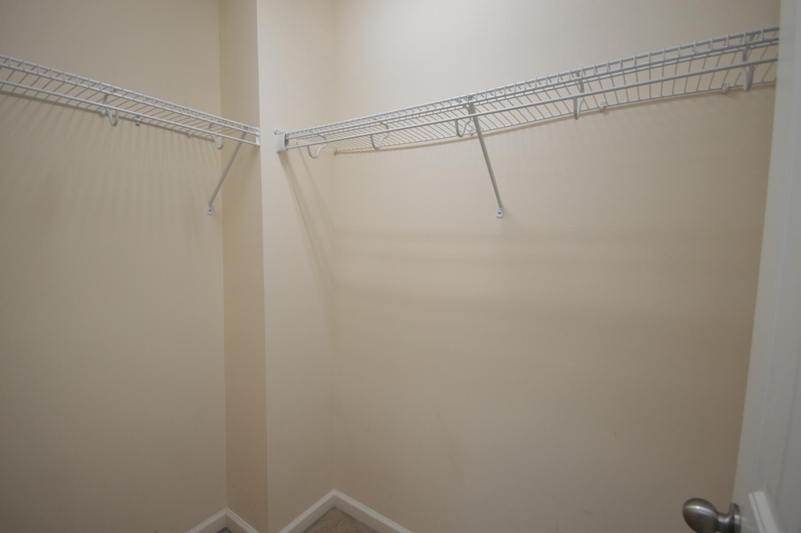 2053 Weston Green Loop Cary, NC 27513 - Photo 25 of 35 a view of a room with racks on the wall