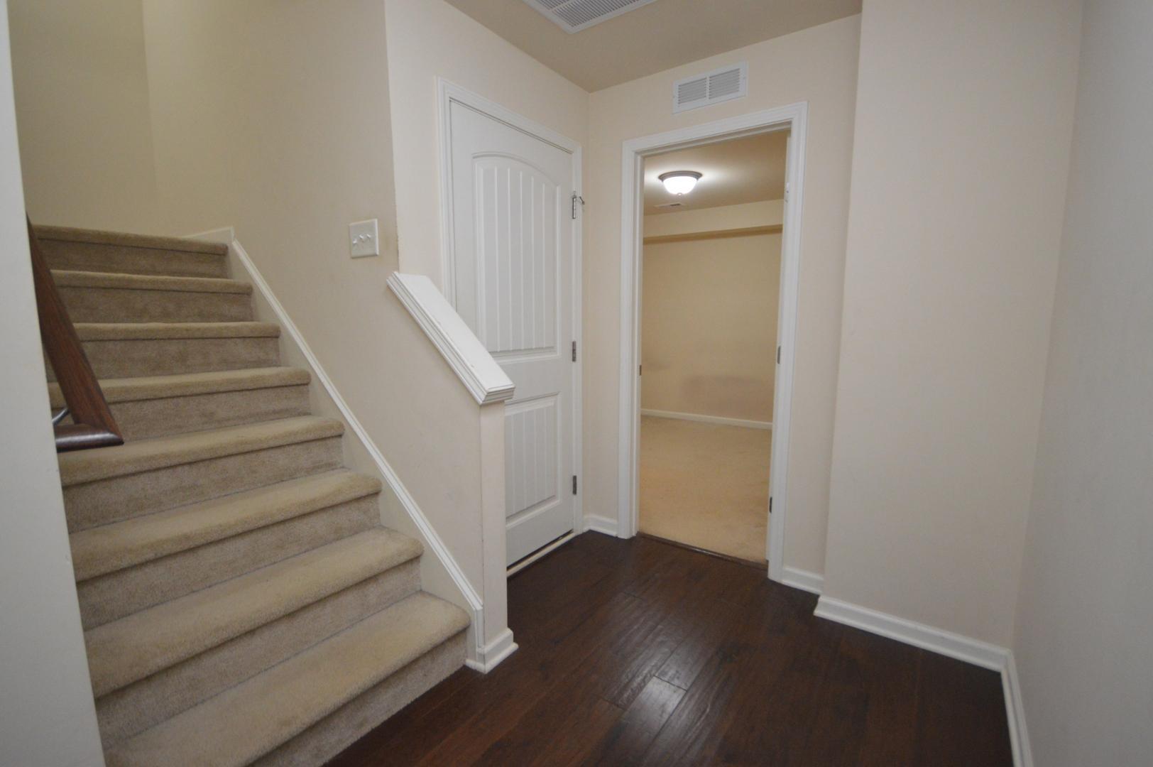 2053 Weston Green Loop Cary, NC 27513 - Photo 27 of 35 a view of entryway with wooden floor