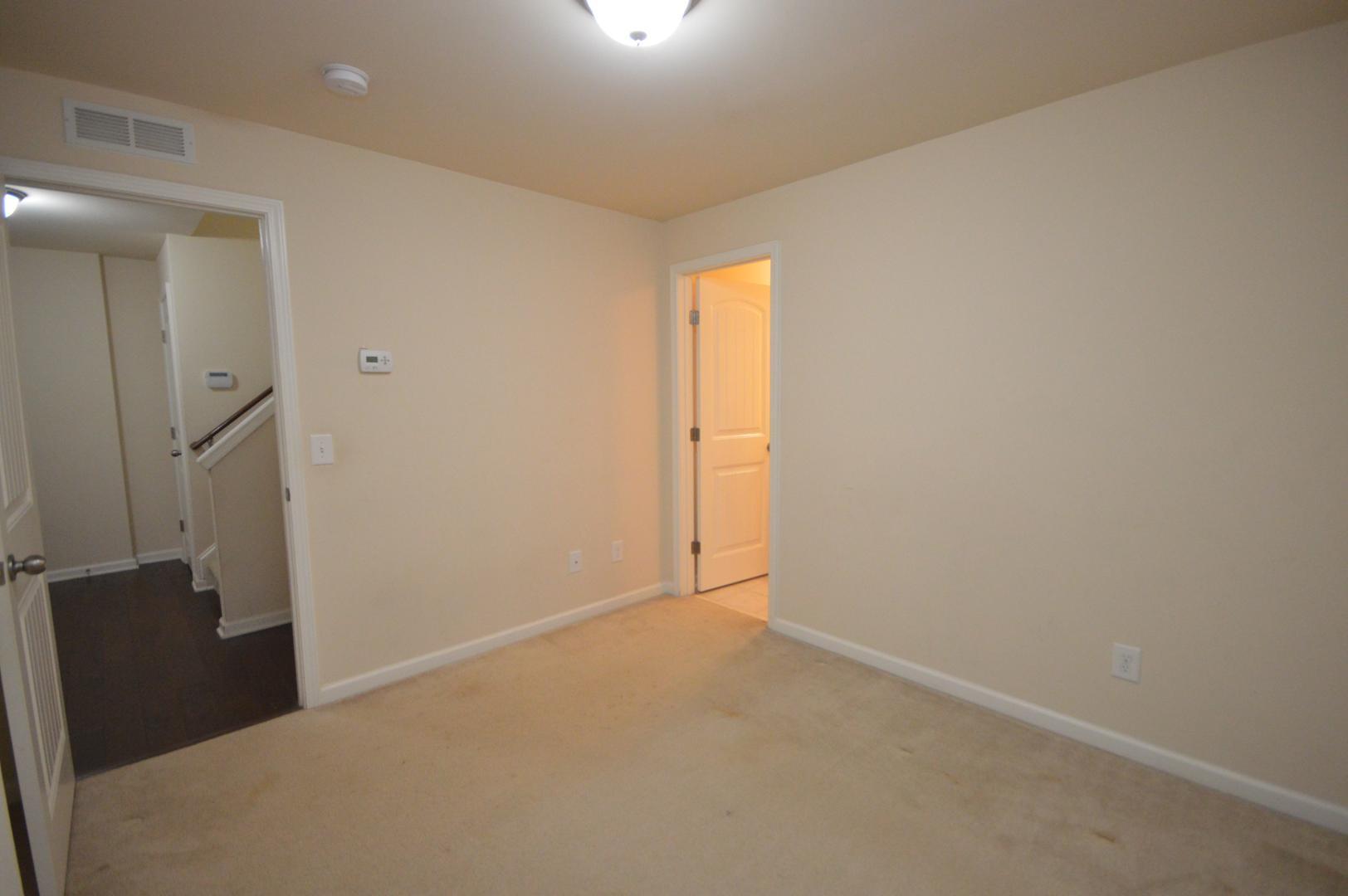 2053 Weston Green Loop Cary, NC 27513 - Photo 29 of 35 an empty room with windows