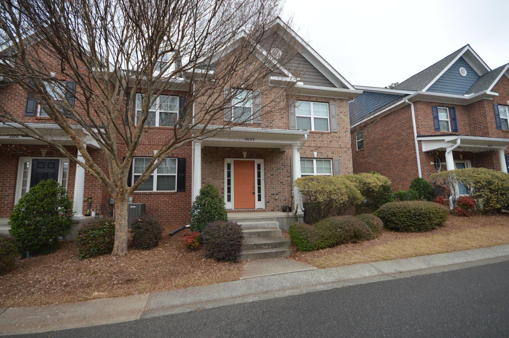 2053 Weston Green Loop Cary, NC 27513 - Photo 3 of 35 a view of a house with a garden