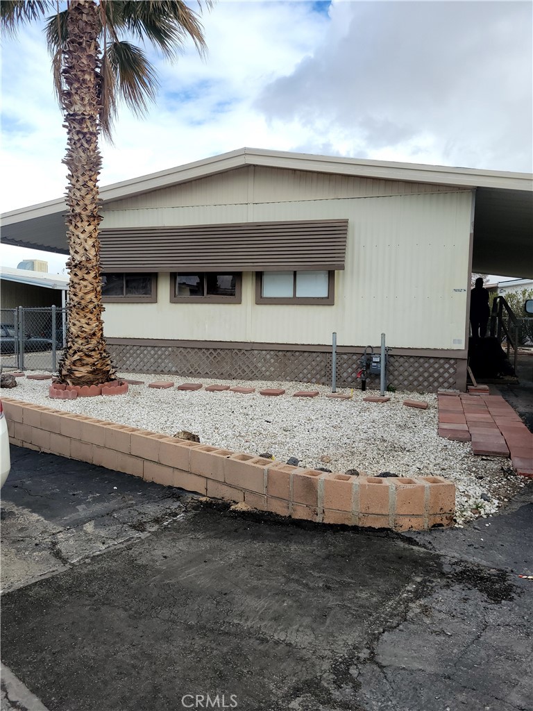 701 Montara Road, Unit 243 Barstow, CA 92311 - Photo 1 of 1 a view of a backyard of a house