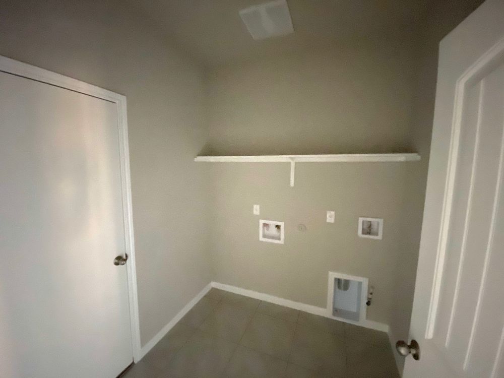 6713 Ranchito Drive Austin, TX 78744 - Photo 6 of 12 Laundry room featuring gas dryer hookup, washer hookup, and tile patterned floors