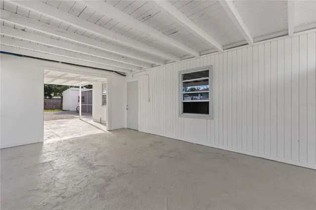 a view of a livingroom with white walls and white walls