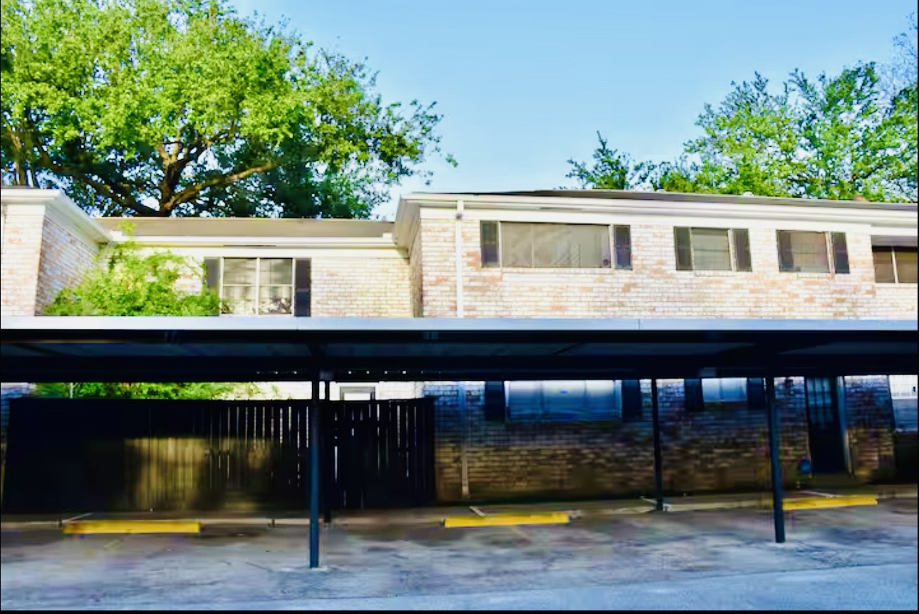 7900 Westheimer Road, Unit 220 Houston, TX 77063 - Photo 14 of 15 a view of a house with a balcony
