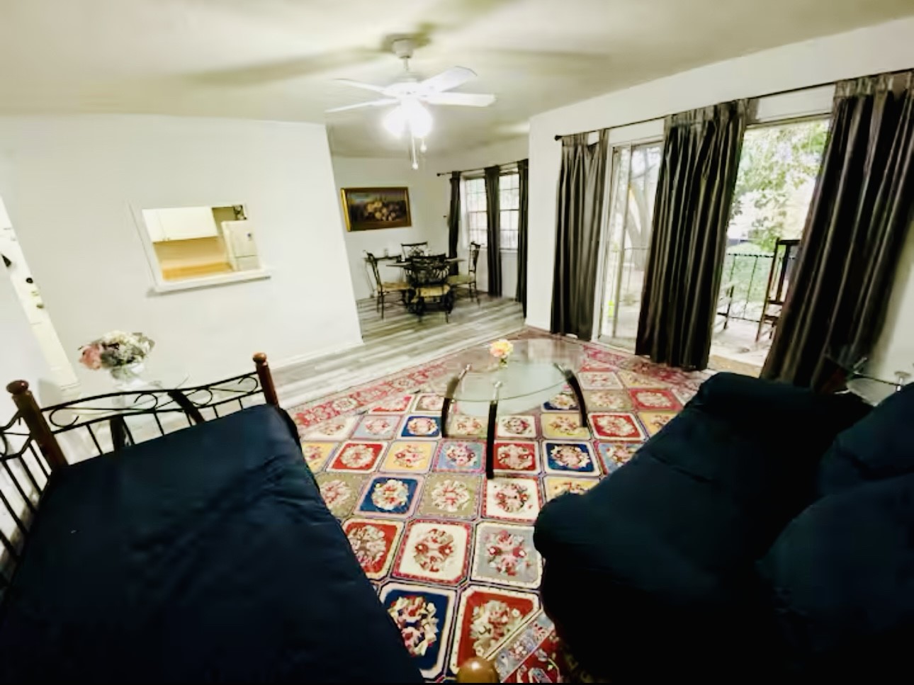 7900 Westheimer Road, Unit 220 Houston, TX 77063 - Photo 2 of 15 a living room with large bed and a large window