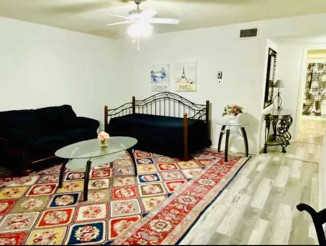 a living room with furniture and a rug
