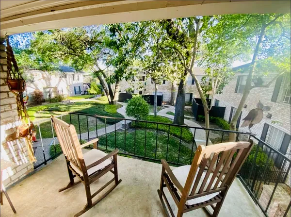 a view of a two chairs in the deck