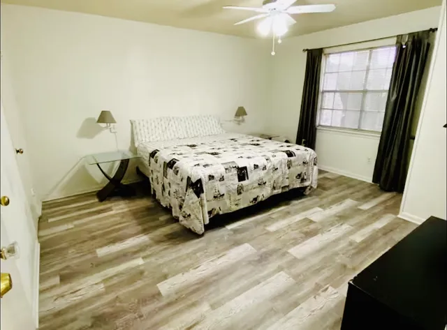 a bedroom with a bed and a window