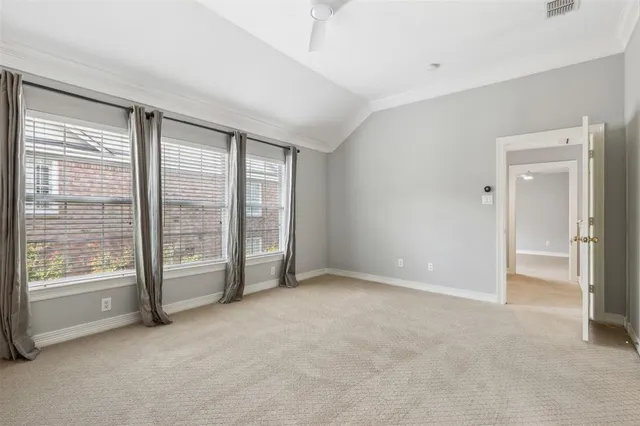 a view of an empty room with glass door