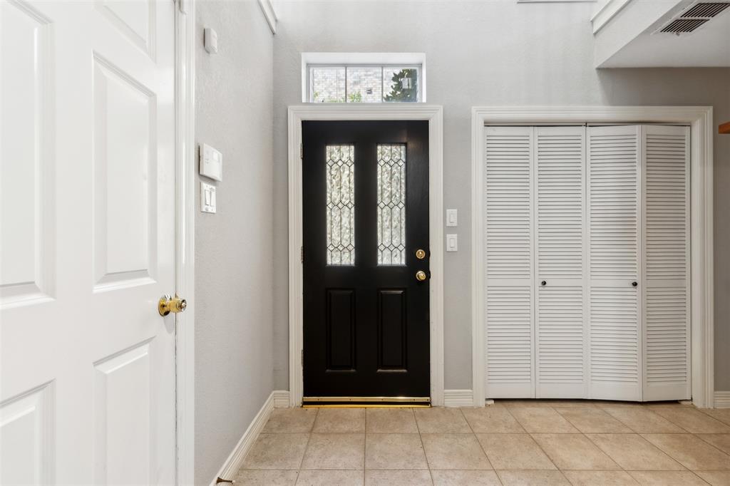 2704 Welborn Street, Unit H Dallas, TX 75219 - Photo 7 of 31 a view of a hallway with wooden door
