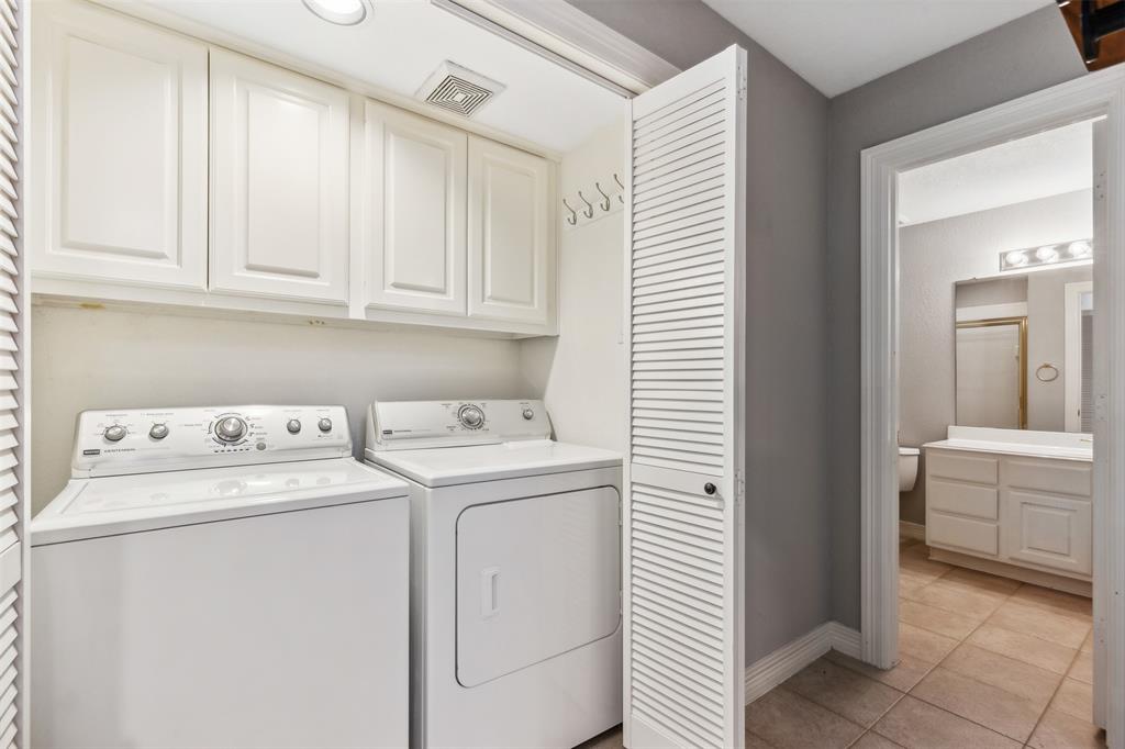 2704 Welborn Street, Unit H Dallas, TX 75219 - Photo 8 of 31 a utility room with dryer and washer