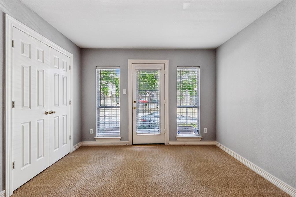2704 Welborn Street, Unit H Dallas, TX 75219 - Photo 10 of 31 an empty room with windows