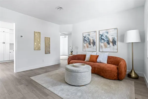 a living room with furniture and a window