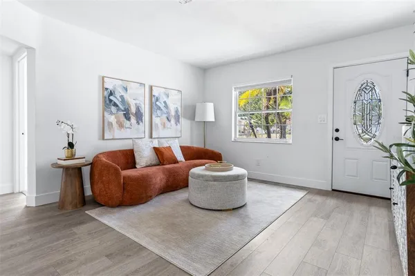 a living room with furniture and a window