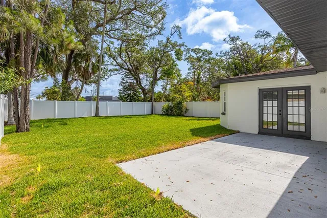 a view of a backyard with a small cabin