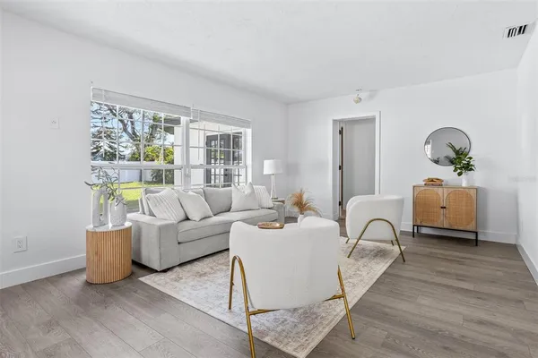 a living room with furniture and a large window