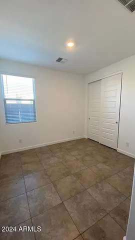 a view of a roof deck with table and chairs