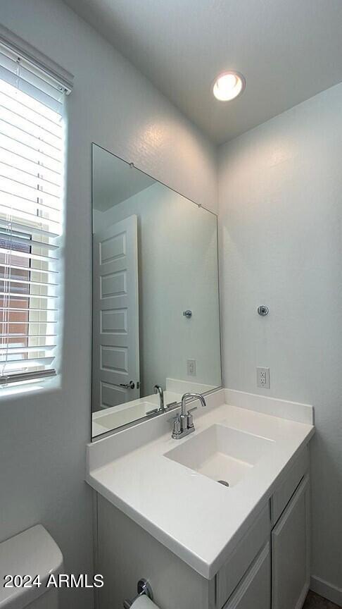 31861 North 125th Lane Peoria, AZ 85383 - Photo 12 of 16 a bathroom with a sink and a mirror