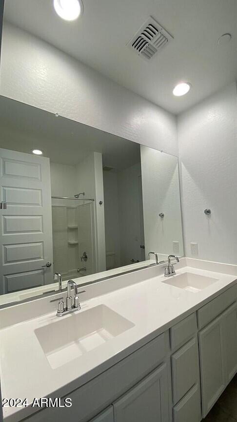 31861 North 125th Lane Peoria, AZ 85383 - Photo 5 of 16 a bathroom with a sink and a mirror
