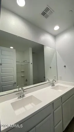 a bathroom with a shower and a bath tub