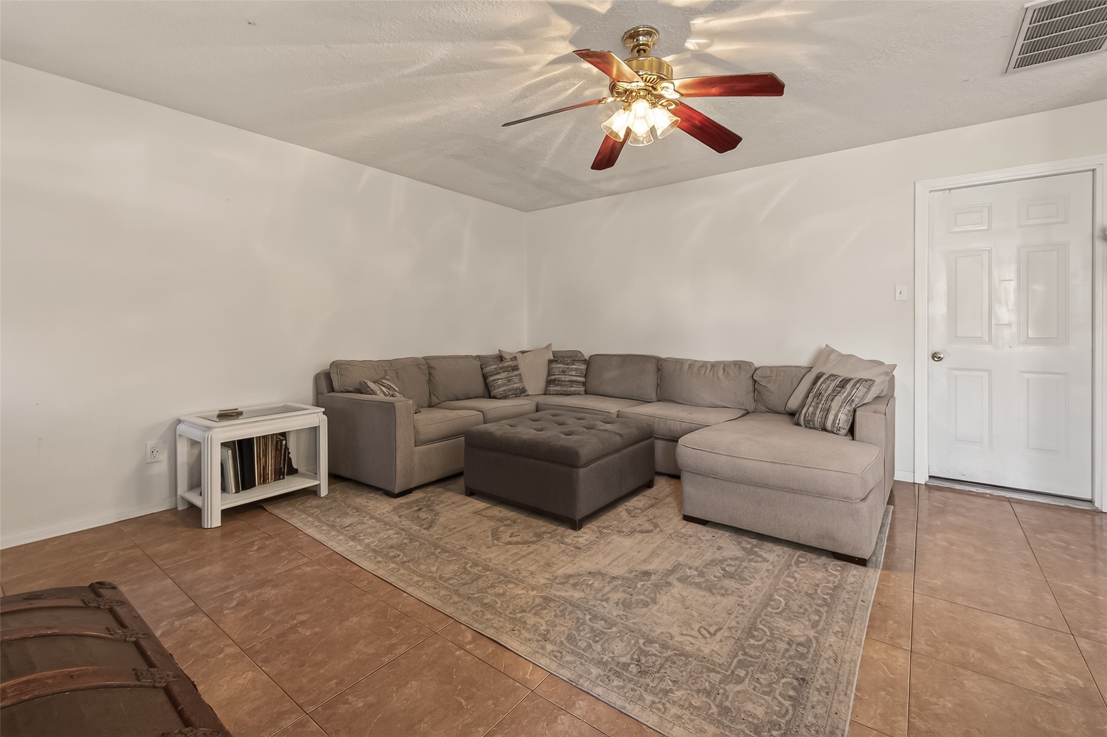 7315 Tara Blue Ridge Drive Richmond, TX 77469 - Photo 11 of 45 a living room with furniture and a chandelier