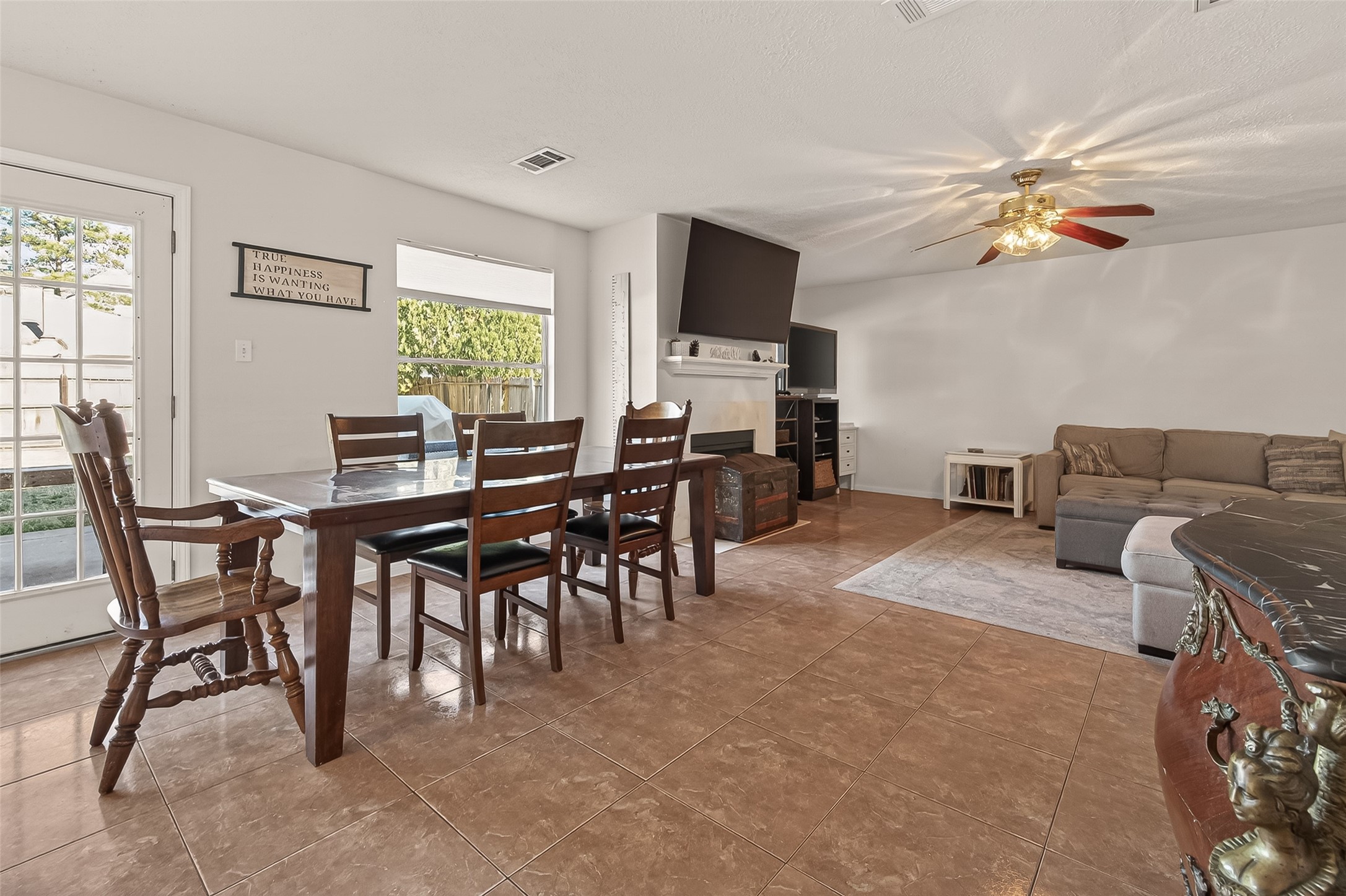 7315 Tara Blue Ridge Drive Richmond, TX 77469 - Photo 13 of 45 a view of a livingroom with furniture and a flat screen tv