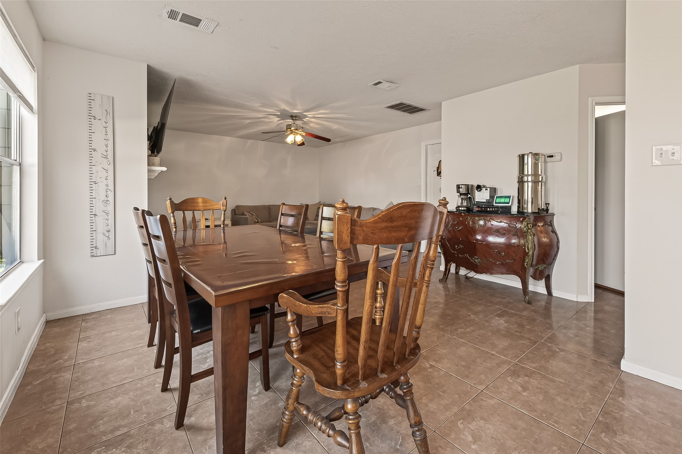7315 Tara Blue Ridge Drive Richmond, TX 77469 - Photo 14 of 45 a view of a dining room with furniture and chandelier