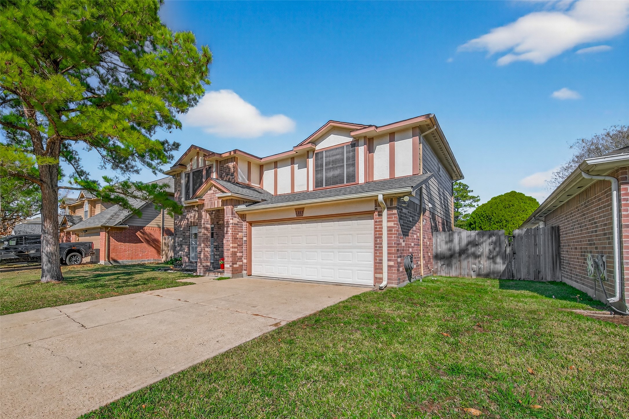 7315 Tara Blue Ridge Drive Richmond, TX 77469 - Photo 2 of 45 a front view of a house with a garden and plants