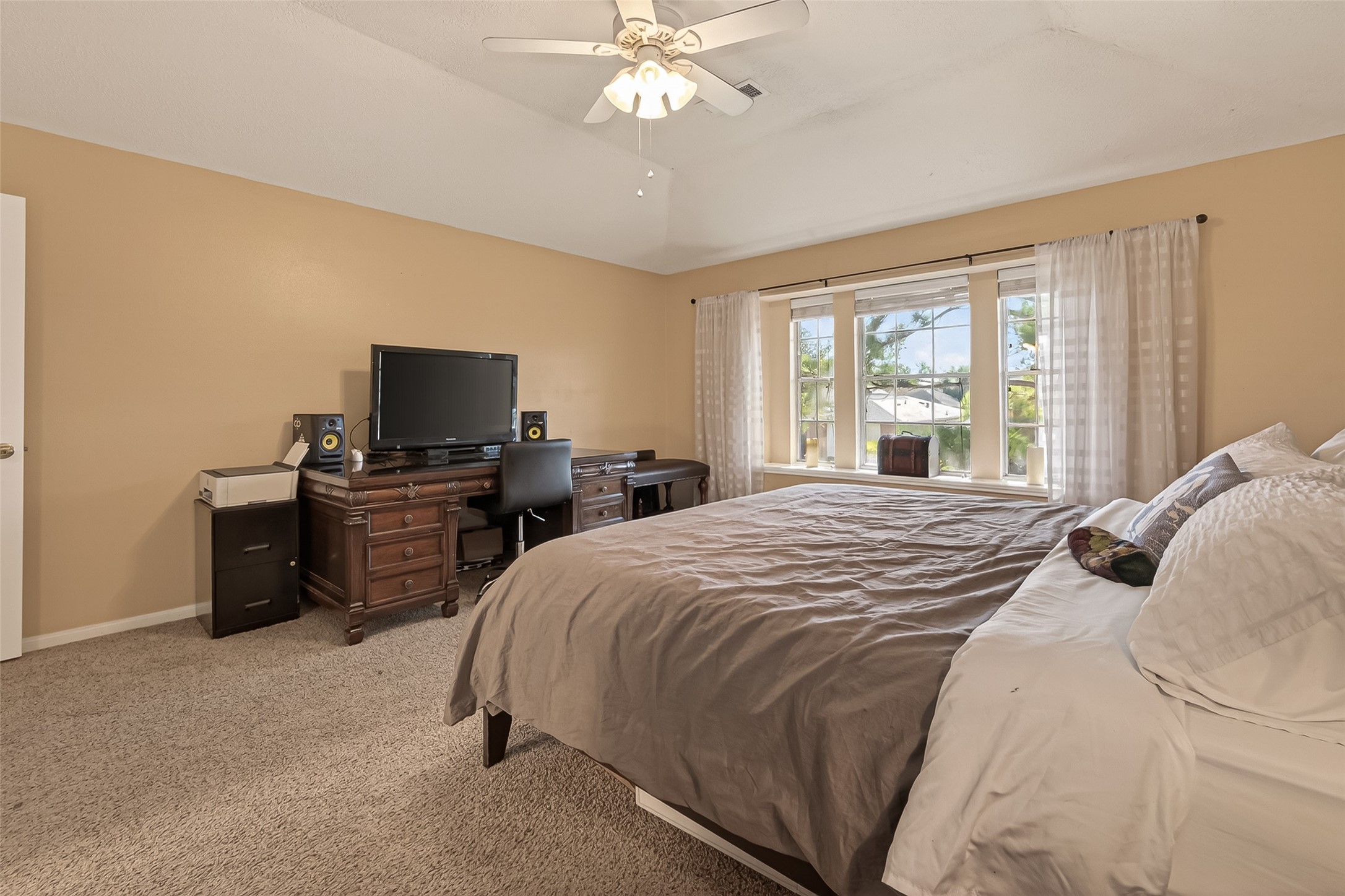 7315 Tara Blue Ridge Drive Richmond, TX 77469 - Photo 24 of 45 a bedroom with a bed and a flat screen tv